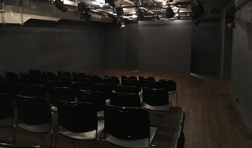View of Studio Theatre stage from behind seats.