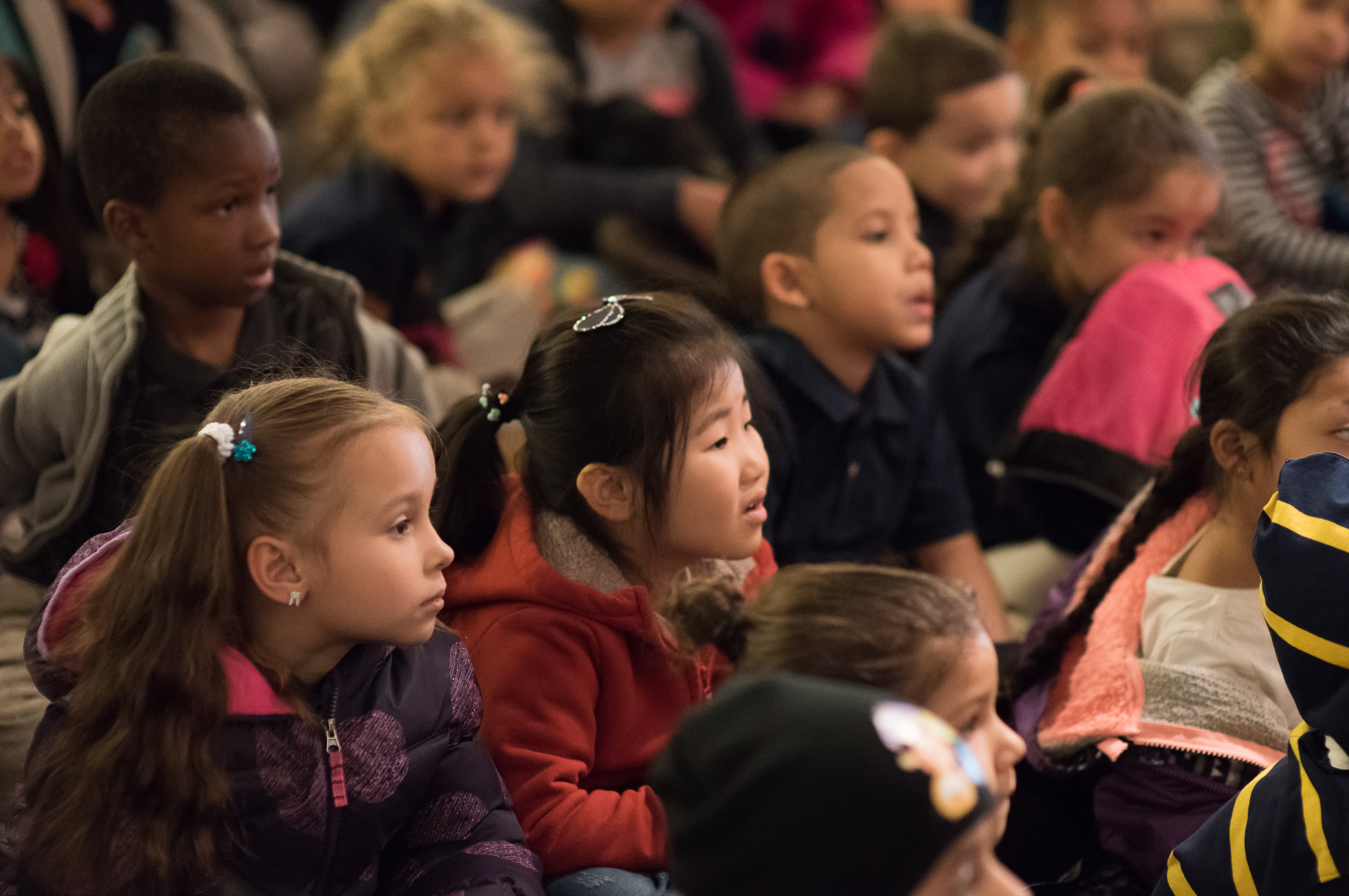 Group of children engaged in New York City Children's Theatre performance.