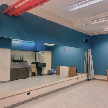 Empty studio with mirrored wall.