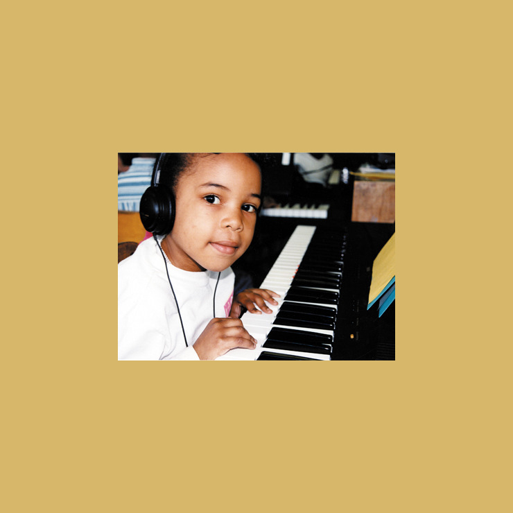 A photo from the early 90s shows a young girl looking at the camera, smiling as she rests her hands on the piano.